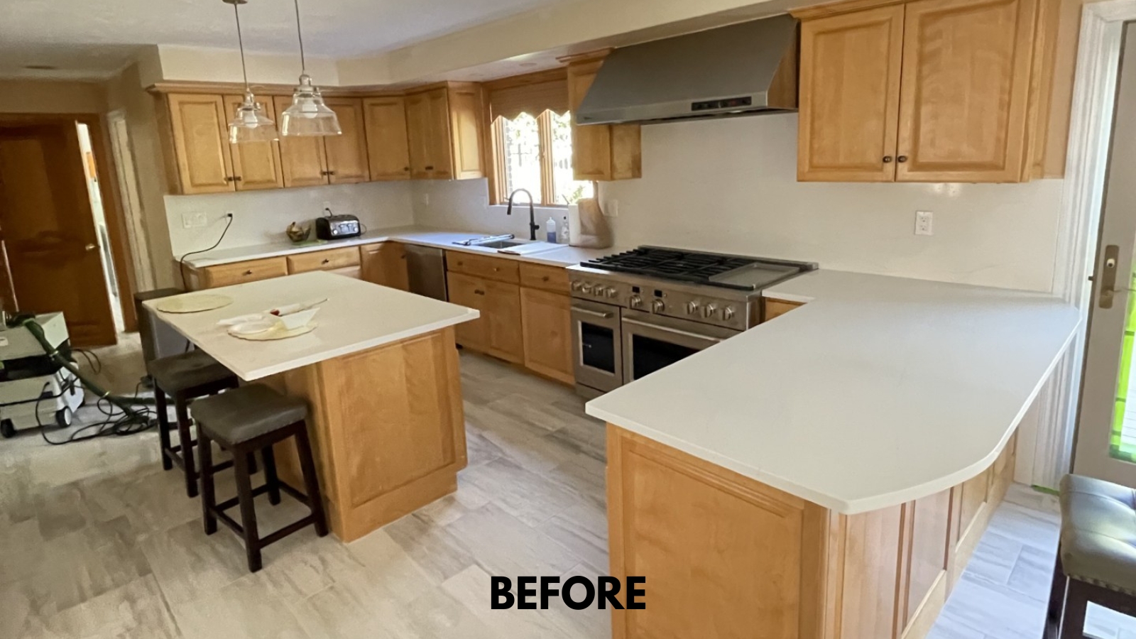 "Before photo of oak kitchen cabinets ready for refinishing in Southborough MA"
